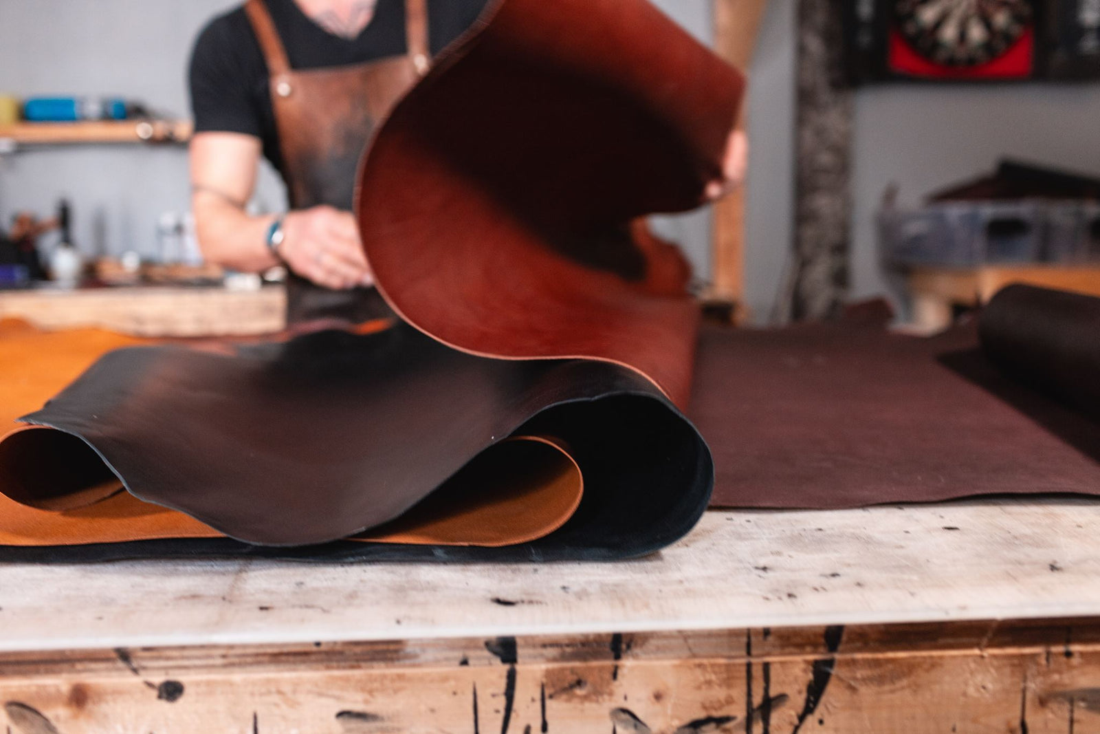 Full-grain leather for leather wallets on a workbench in Peterborough Ontario. Solid Leather lasts 